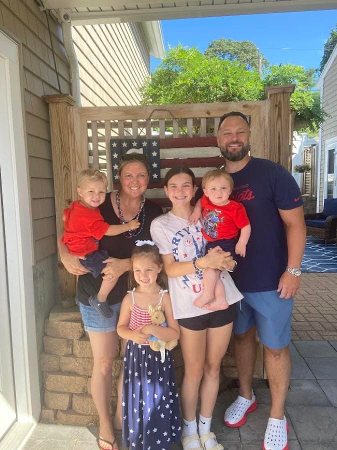Jason Berube with his family at home in Beverly, Massachusetts
